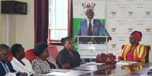 Prof. Barnabas Nawangwe standing address Management and the press during the official handover of the report on 25th June 2018